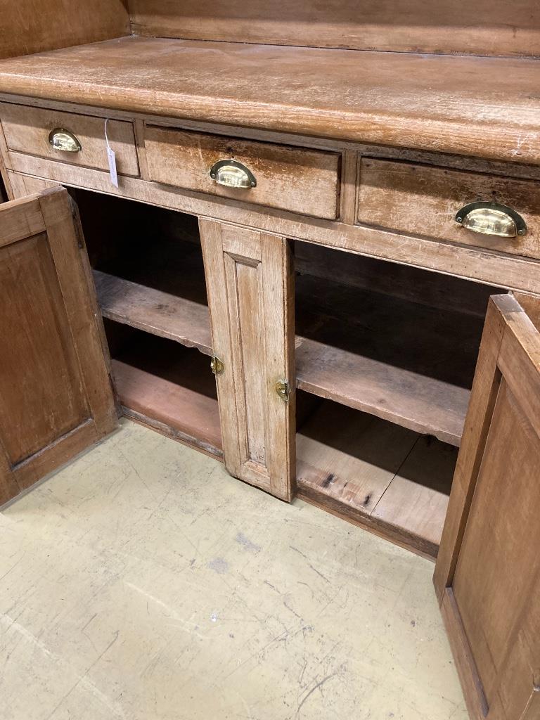 A Victorian pine dresser (lacks rack), length 138cm, depth 52cm, height 152cm